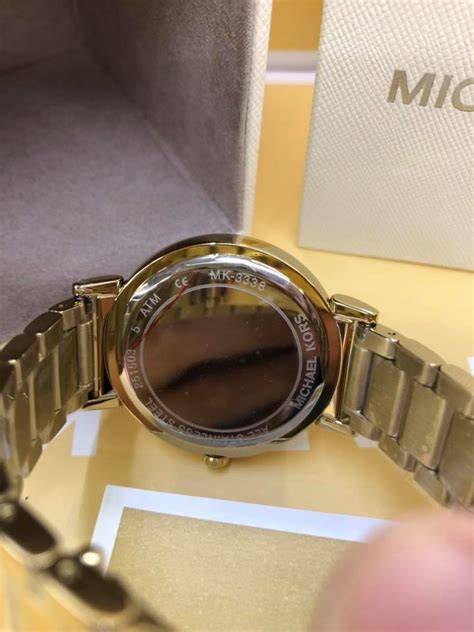 how to tell if a michael kors watch is real|michael kors watch authenticity check.